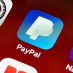 Detailed view of PayPal app icon on a smartphone screen highlighting mobile payment technology.